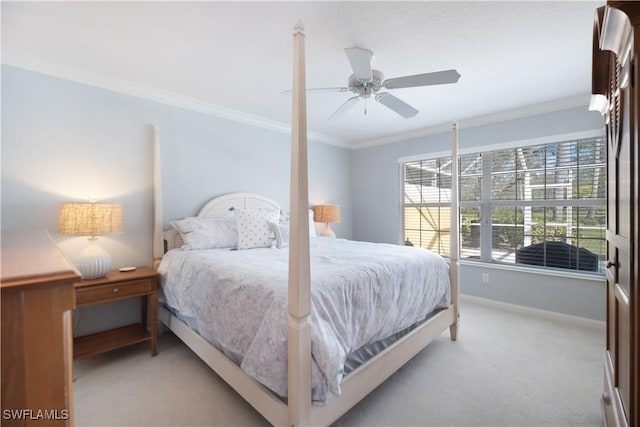 carpeted bedroom with crown molding and ceiling fan