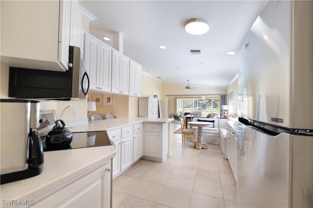 kitchen featuring light tile patterned floors, ornamental molding, appliances with stainless steel finishes, kitchen peninsula, and white cabinets