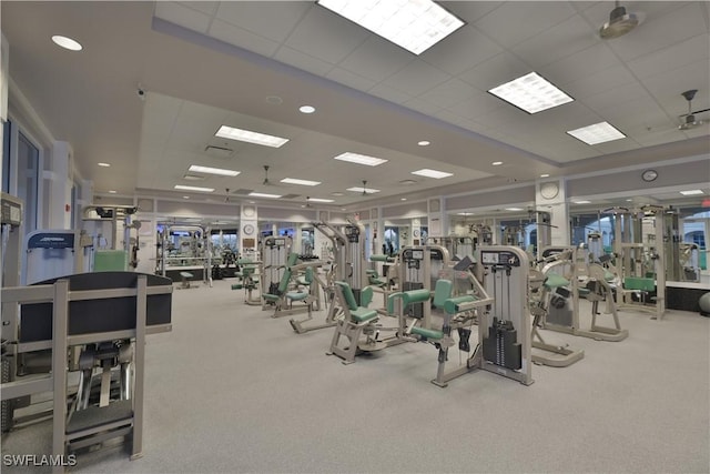 workout area with light colored carpet and a drop ceiling