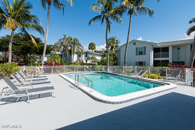 800 S Golf Dr Unit N205, Naples, FL 34102 - community pool featuring fence and a patio area