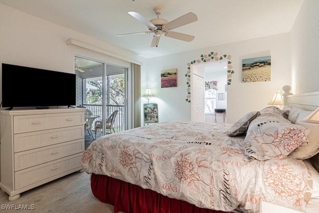 bedroom with access to outside, light colored carpet, and ceiling fan