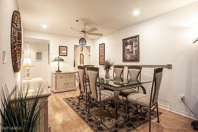 dining space featuring light hardwood / wood-style flooring and ceiling fan