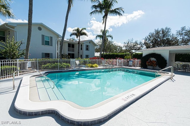 view of swimming pool with a patio