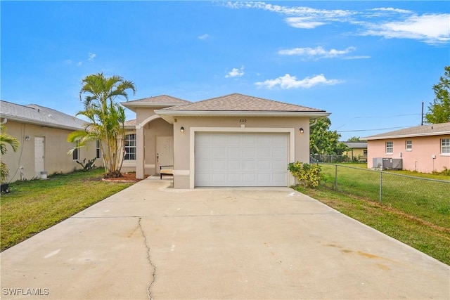 view of front of home with a garage and a front yard