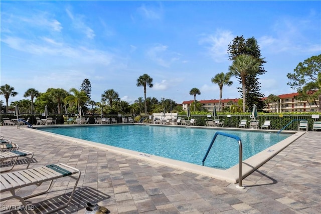 4372 27th Ct SW Unit 301, Naples, FL 34116 - community pool with a patio area