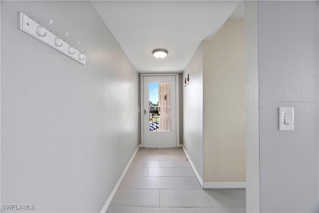4372 27th Ct SW Unit 301, Naples, FL 34116 - corridor with baseboards and light tile patterned floors