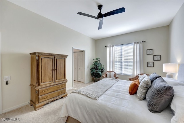 bedroom featuring light colored carpet and ceiling fan