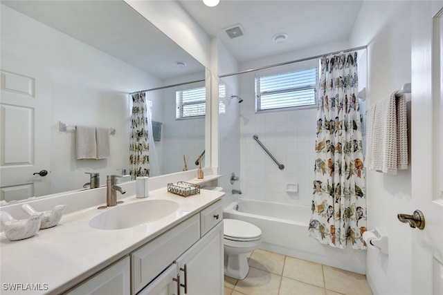 full bathroom featuring vanity, toilet, tile patterned flooring, and shower / tub combo