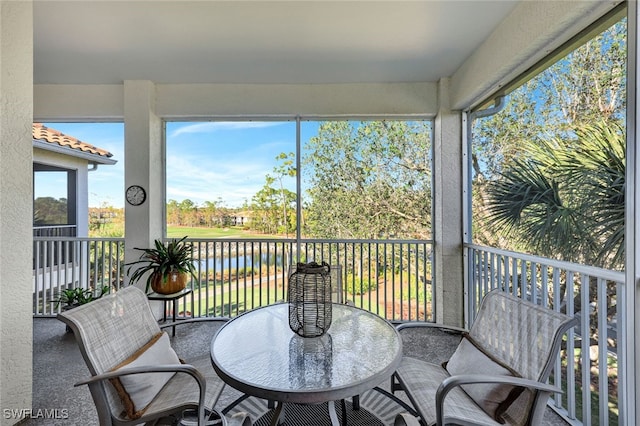 sunroom with a water view