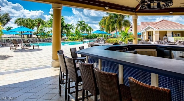 view of patio with a bar