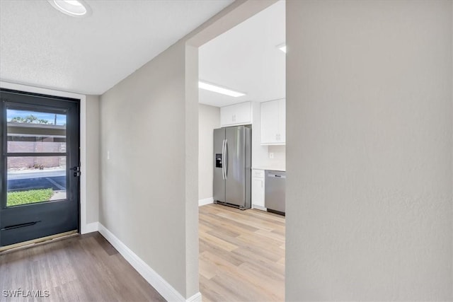 entrance foyer featuring light hardwood / wood-style floors