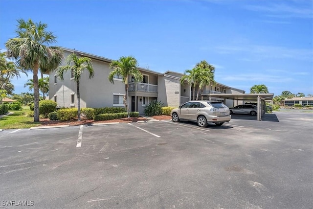 view of parking / parking lot with a carport