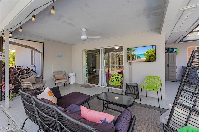 view of patio with ceiling fan and an outdoor living space