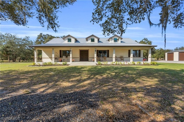 farmhouse-style home with a porch, a garage, and a front yard