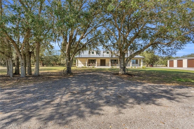 single story home featuring a garage and a front yard