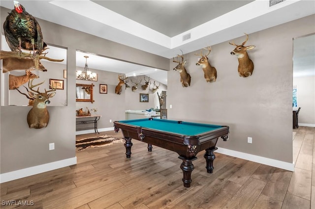 game room with billiards and hardwood / wood-style floors