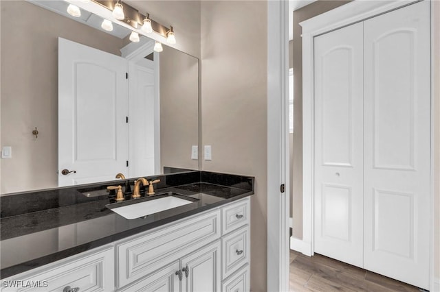 bathroom with wood-type flooring and vanity