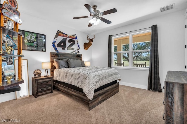 carpeted bedroom with ceiling fan