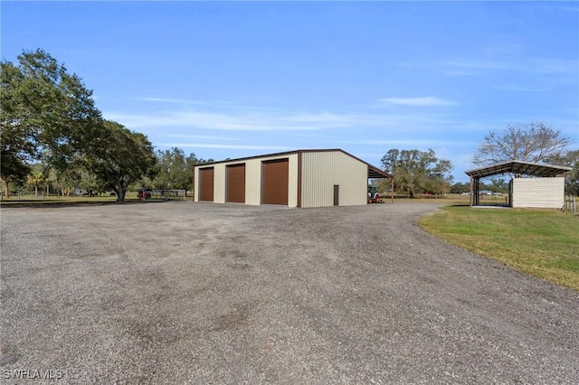 garage featuring a lawn