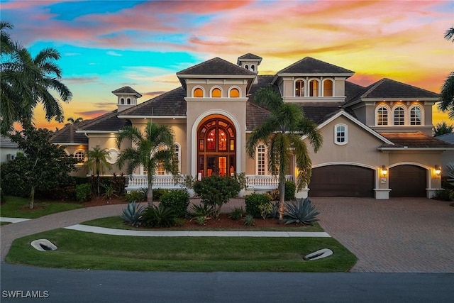 mediterranean / spanish-style home with a garage