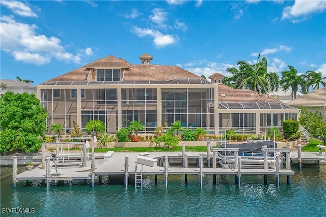 dock area with a water view and glass enclosure