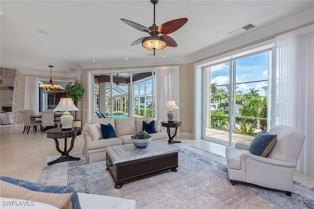 living room featuring ornamental molding, ceiling fan with notable chandelier, and light tile patterned floors