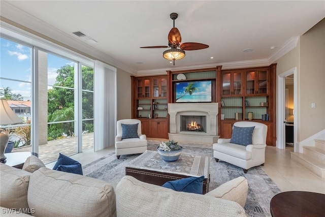 living room with crown molding and ceiling fan