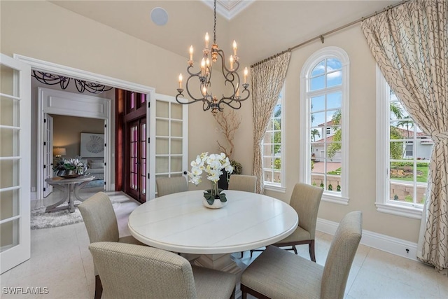 dining room with an inviting chandelier and french doors