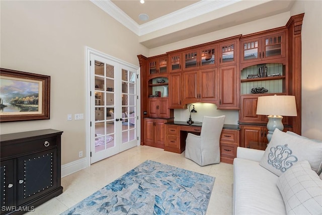 office area with crown molding, built in desk, and french doors