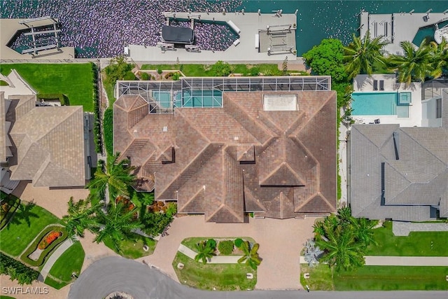 birds eye view of property featuring a water view