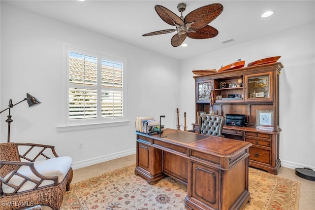 tiled office featuring ceiling fan