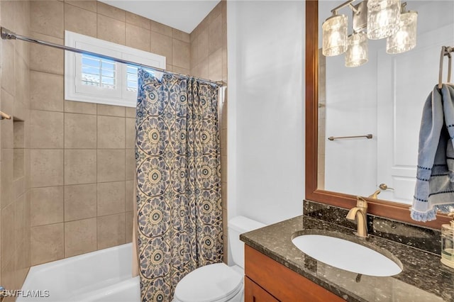 full bathroom featuring vanity, toilet, and shower / tub combo