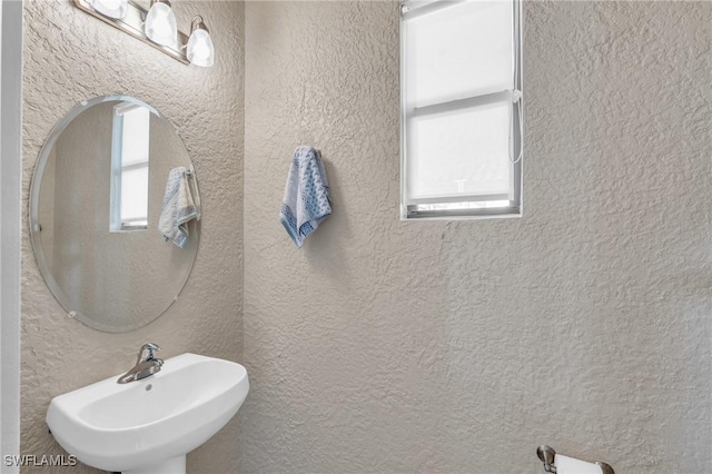 bathroom featuring sink and plenty of natural light