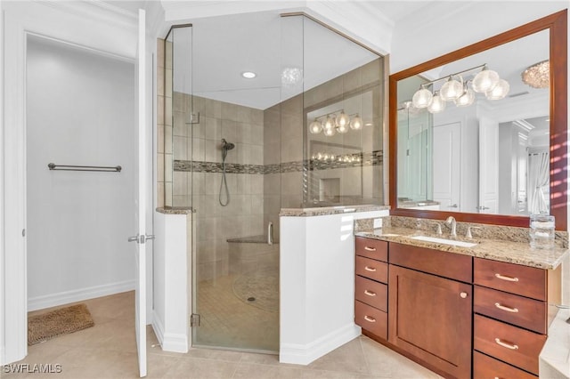 bathroom featuring ornamental molding, vanity, an enclosed shower, and tile patterned flooring