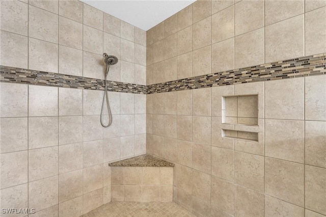 bathroom featuring tiled shower