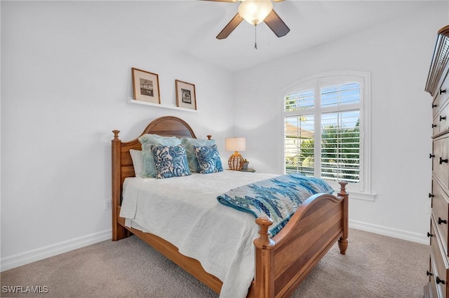 bedroom with ceiling fan and light colored carpet