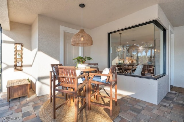 dining room with a textured ceiling