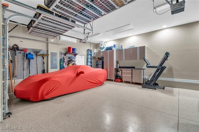 garage with a garage door opener and electric panel