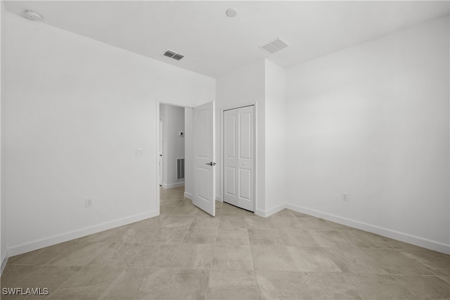 unfurnished bedroom featuring a closet