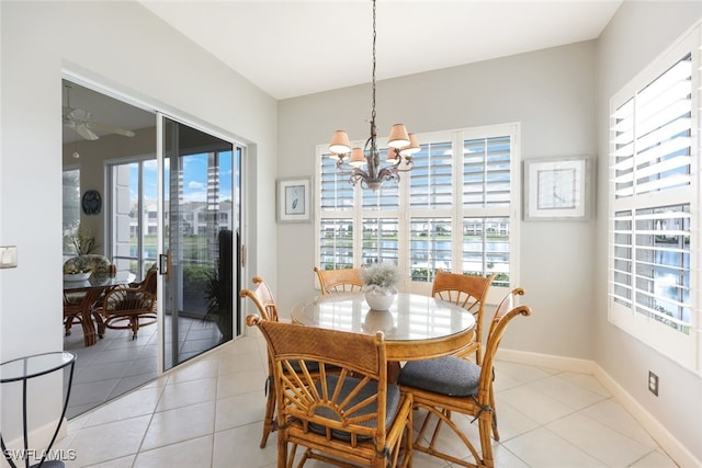 dining area featuring light tile patterned flooring and a healthy amount of sunlight