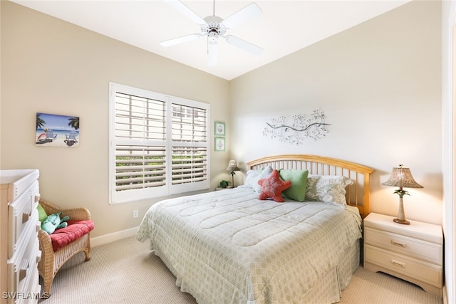 bedroom with light colored carpet and ceiling fan