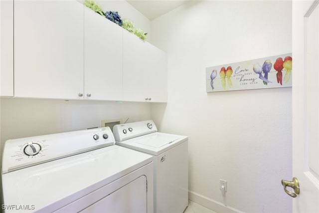 washroom with cabinets and separate washer and dryer