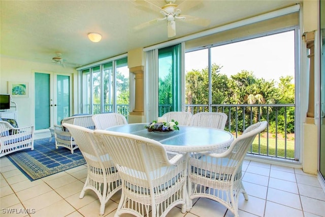 sunroom featuring ceiling fan