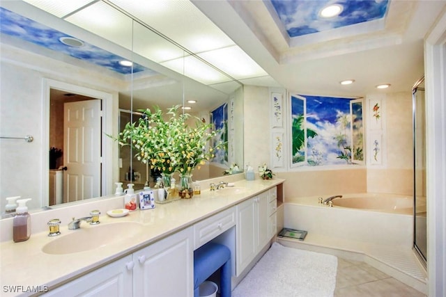 bathroom featuring a raised ceiling, vanity, separate shower and tub, and tile patterned floors