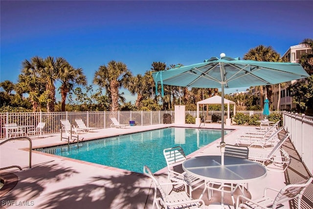 view of swimming pool with a gazebo and a patio