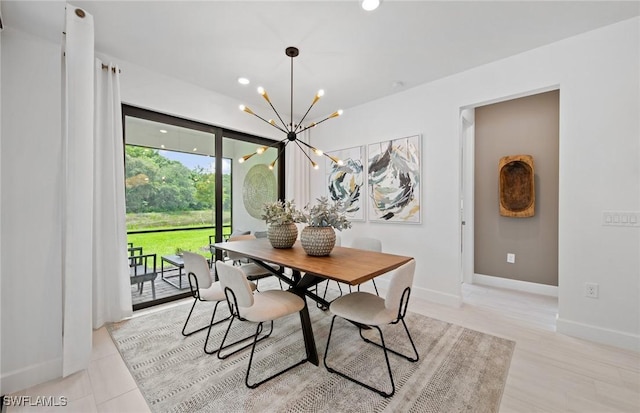 dining area with an inviting chandelier