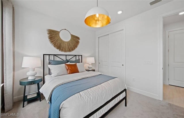 carpeted bedroom with a closet