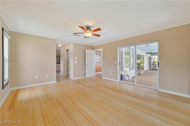 interior space featuring crown molding, ceiling fan, and light wood-type flooring