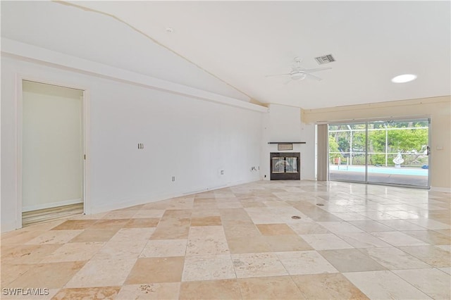 unfurnished living room featuring ceiling fan and lofted ceiling