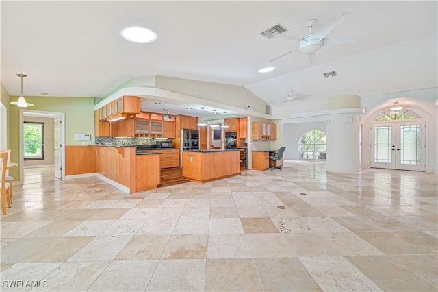 kitchen with french doors, a healthy amount of sunlight, decorative light fixtures, and kitchen peninsula